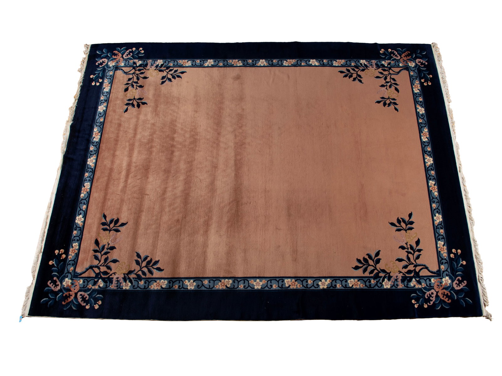 CHINESE PEKING ROOM RUG: CHINESE PEKING ROOM RUG Chinese, early 20th century. With an open soft-peach colored field showing leaf filled branches near each corner, the field is surrounded by a royal blue border with flowers