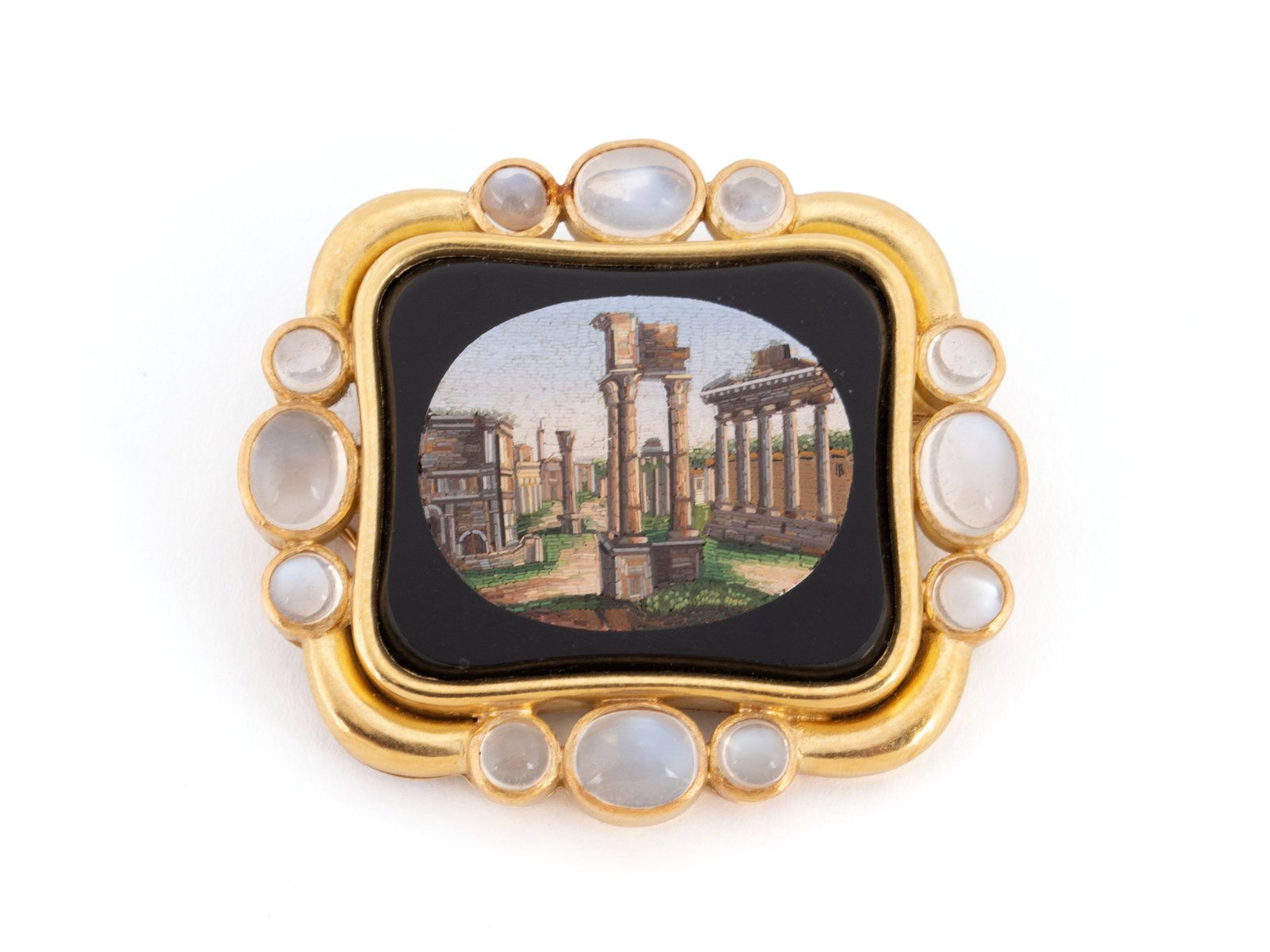 ELIZABETH LOCKE MICROMOSAIC PENDANT/BROOCH: ELIZABETH LOCKE MICROMOSAIC PENDANT/BROOCH An 18k yellow gold pendant/brooch containing a 19th century micro mosaic of an ancient Roman forum with twelve (12) cabochon moonstones. Hallmark to verso.