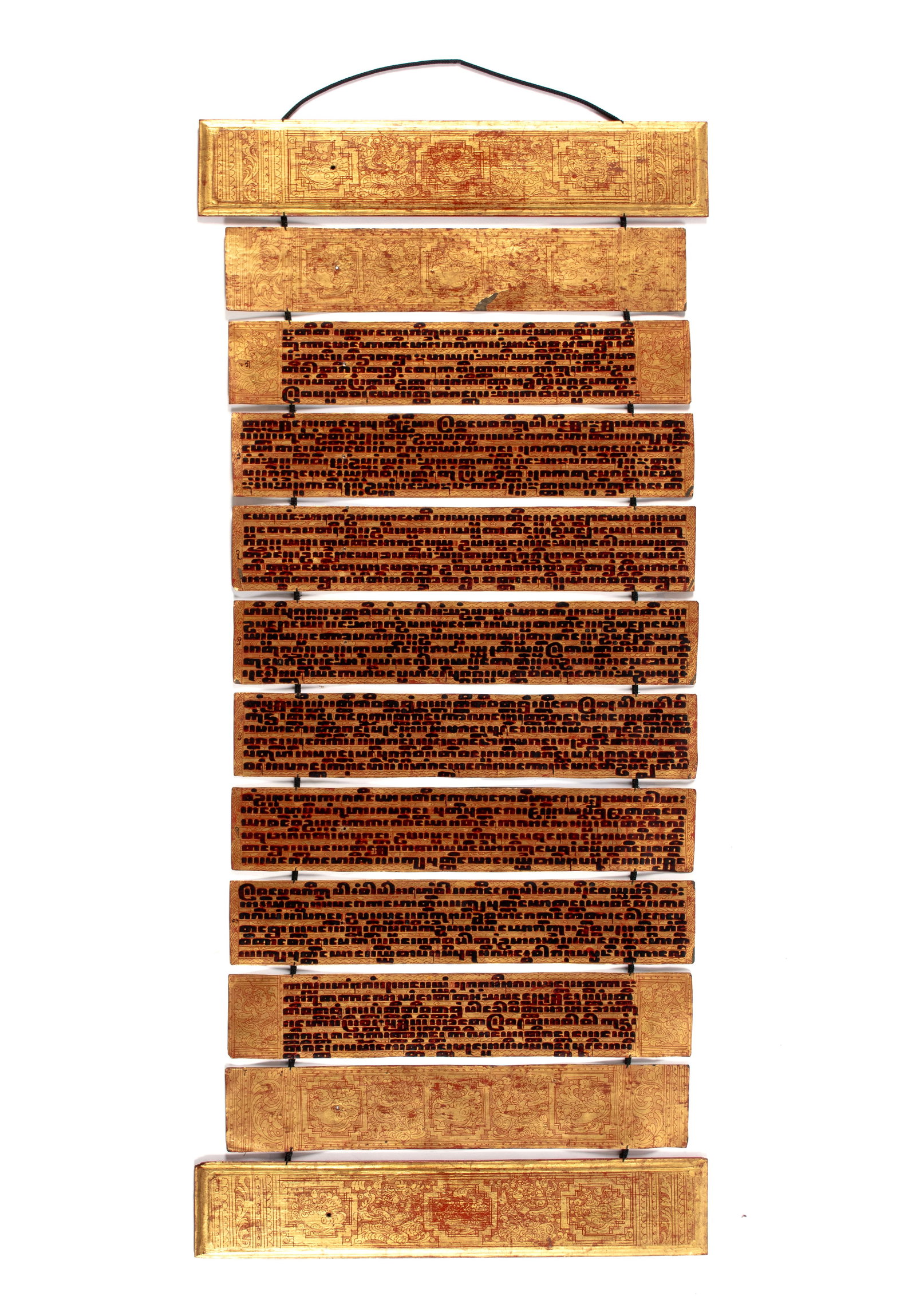 BURMESE BUDDHIST KAMMAVACA MANUSCRIPT PRAYER PANELS: BURMESE BUDDHIST KAMMAVACA MANUSCRIPT PRAYER PANELS Myanmar, 20th century. Gilt with red highlights to both wooden end boards, holding 10 pages of prayerful text between them. Open: 48 x 21 in.