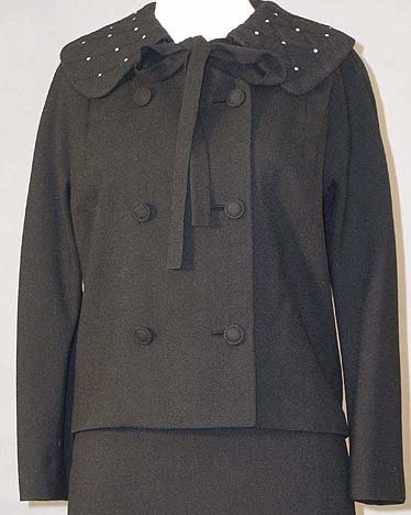 Lilli Ann Black Wool Vintage Suit w/ Quilted Collar: A lovely Lilli Ann suit! Boxy jacket has a quilted, round collar accented with prong set rhinestones. Thin neck tie is attached under the collar. Jacket has a gathered back. Matching straight skirt. J
