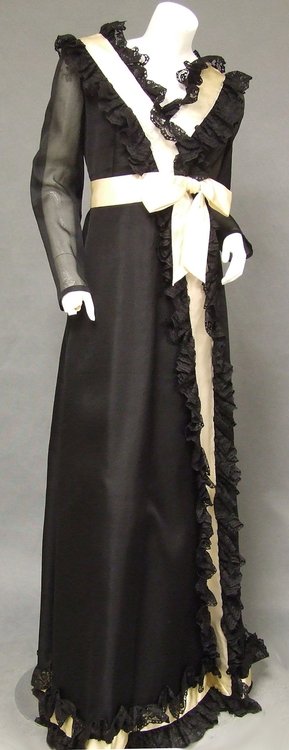 Sarmi Black & Cream Victorian-esque Gown Lace & Satin: A great vintage evening gown from the Sarmi collection. One of those classic 1970's Victorian styled gowns with satin and lace frills. Sheer sleeves with self fabric buttons. Lined. "Designed by Sarmi