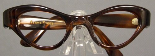 Classic UNWORN 1950s Cateye Eyeglasses Frame: A classic N/OS unworn authentic vintage cat eye eyeglasses frame (no lenses) in a translucent amber. Made in France. Size: 44-22 | 4 3/4" wide from hinge to hinge | 5 1/2" arm