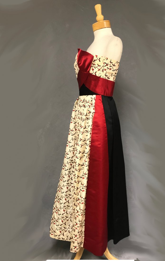 Stunning Oleg Cassini Strapless Evening Gown 50s 60s: An amazing late 1950's/early 1960's Oleg Cassini evening gown in ivory taffeta with black and red floral embroidery. Completed with black and red satin. Heavily boned, interfaced bodice with interior
