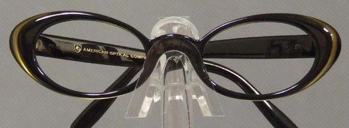 UNWORN 1960s Black Gold Eyeglasses Frames: Authentic vintage 1960s eyeglasses frames in black with a subtly shimmering gold band around the edge (the light in the photos makes the band look very pronounced but it is much more subtle in person)