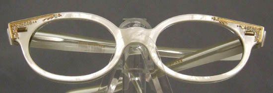 UNWORN 1950s 1960s Swank Optical Eyeglasses Frames: A stunning authentic vintage 1950s 1960s eyeglasses frame in a shimmering pearl on crystal. Gold etching/appliques & Ab rhinestones. Made by Swank in France. Size: 44-20 | 4 5/8" wide | 5 1/4" arm