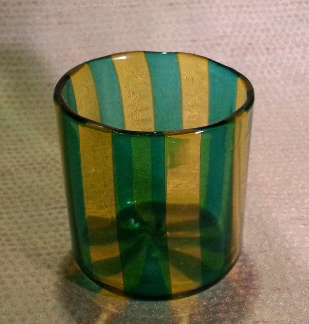 Gio Ponti Amber & Green A Canne Tumbler: Amber and green hand blown striped glass tumbler. Ground and polished pontil. Possibly Gio Ponti - A Canne - Murano Glass Size: top 3 1/4" diameter; 3 3/8" high Condition: very good Original Manufactu