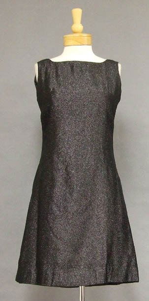 Sparkling Black 1960's Mini Dress: A fun 1960's dress in a shimmering black mylar. Simply shaped sleeveless dress with high neck and back. Rear metal zipper. Lined in acetate. Size: 35" bust, 29" waist, 36 1/2" hips. Approximately 36 1