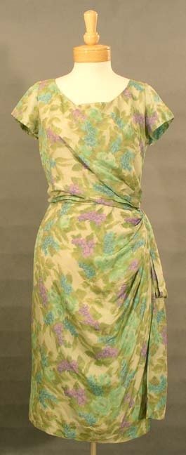 Frank Starr Floral Silk Sarong 1950s Cocktail Dress XL: A really elegant vintage silk sarong dress in an understated floral pattern. Short sleeved bodice. The dress has a sarong type skirt with side sash. Rear metal zipper. Dress is lined. Frank Starr labe