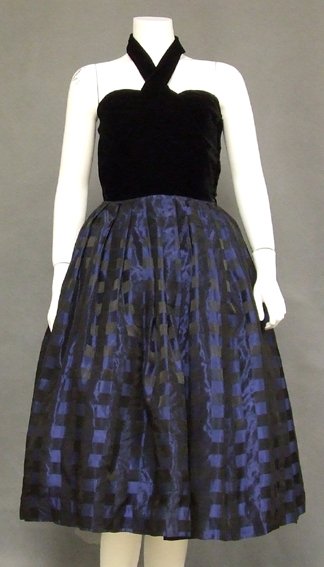 Black Velvet & Checked Taffeta 1950s Halter Dress: A cool 1950s cocktail dress. Plush black velvet bodice with chic crossed halter. Dress has a semi-full pleated skirt of checked black and blue taffeta (shown here with a small crinoline... not include