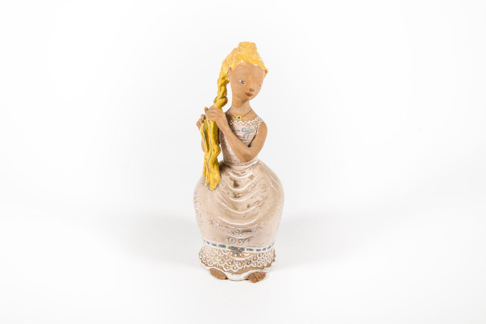 Kovacs Margit (1902-1977): Hair-braider girl, 1956: Kovacs Margit (1902-1977): Hair-braider girl, 1956; painted, glazed terracotta, signed at the backside: KM, front: 1956, pressed into the mass: Made in Hungary, corrected foot; 34 cm
