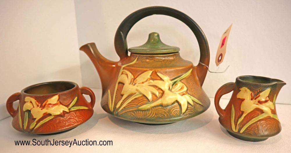 Roseville 3 piece Zephyr Lily tea set: Roseville 3 piece Zephyr Lily tea set Dimensions: teapot 7" h x 9" w sugar 2 1/2" h x 5" w creamer 3" h x 3 1/2" w