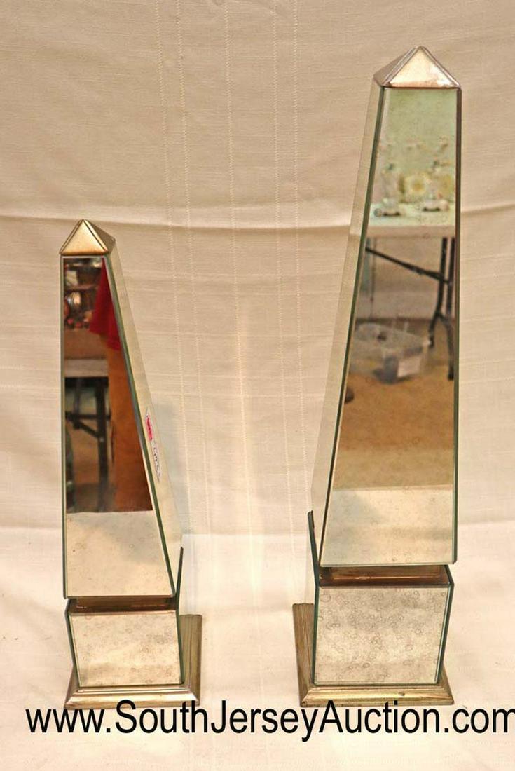 PAIR of mirrored decorative table columns: PAIR of mirrored decorative table columns Dimensions: (1) 24" h x 6" square (1) 19" h x 5" square