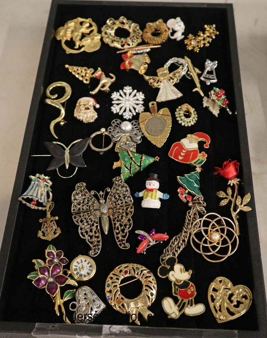 Tray lot of Christmas brooches, Mickey Mouse brooches,: Tray lot of Christmas brooches, Mickey Mouse brooches, and others and a Buffalo Nickel arrow head pendant