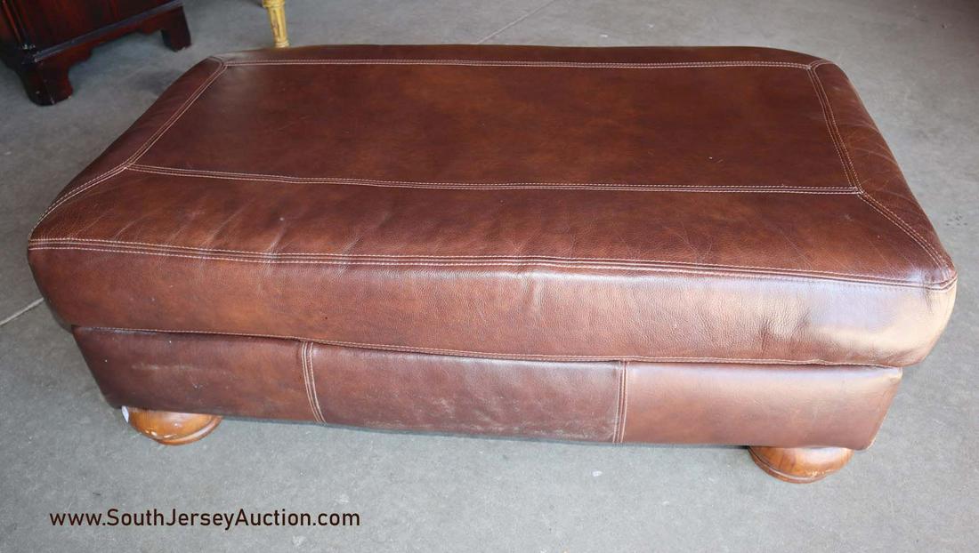 Brown leather ottoman: Brown leather ottoman Dimensions: 44" w x 25" d x 16" h