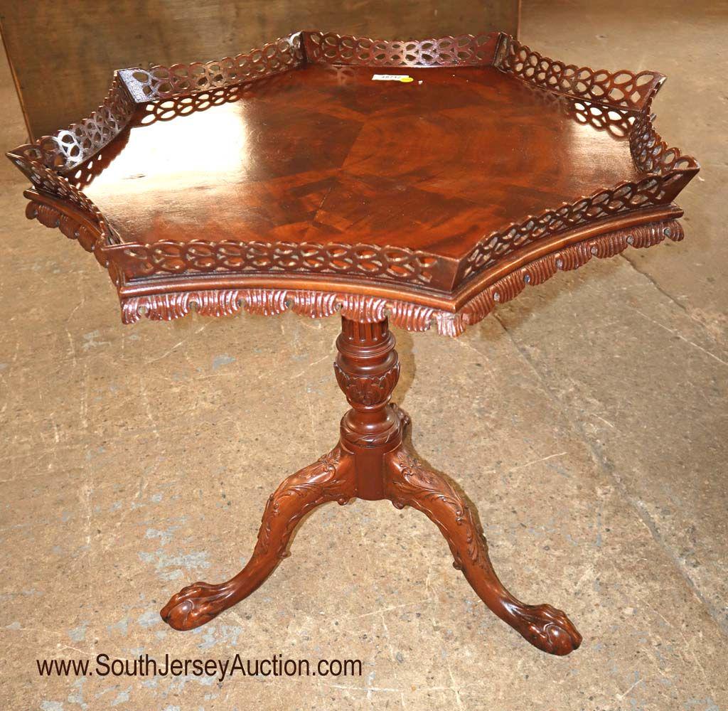 Beautiful pierce, scalloped, Chipp tilt top table: Beautiful pierce carved and scalloped ball and claw Chippendale tilt top table Dimensions: 32" diameter x 30" h When tilted: 43" h