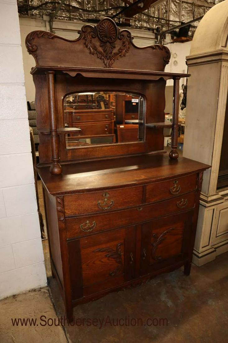 Antique Oak Original Finish Buffet with Mirror Back: ANTIQUE oak original finish buffet with mirror back and applied carving with original cast brass hardware 43" w x 23" d x 76" h