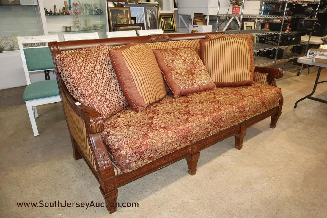 Nice Antique Style Carved Mahogany Finish Frame Sofa: Nice antique style carved mahogany finished frame sofa with pillows. Dimensions: 84"l x 42"d x 40"h