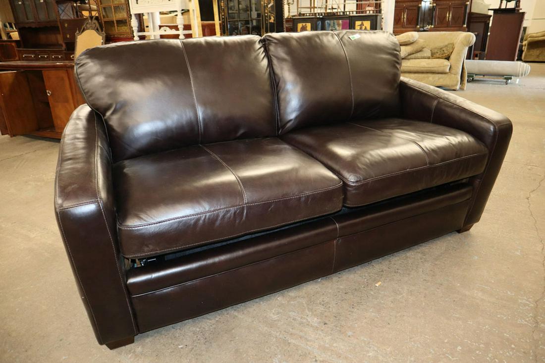 Like new dark brown leathersleeper loveseat: Like new chocolate dark brown leather 2 cushion sleeper loveseat approx. 72" w x 36" d x 36" h