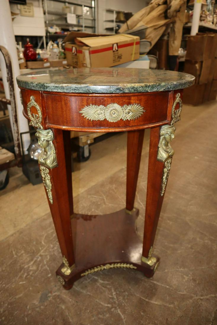 Marble top center table with applied bronze: Marble top center table with applied bronze approx. 23" diameter x 33" h