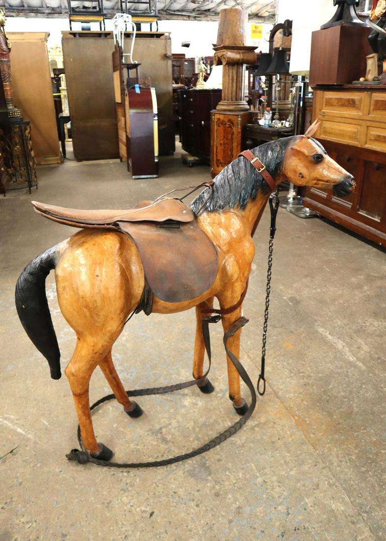 Antique style wooden horse with saddle: Antique style wooden horse with saddle approx. 42" w x 12" d x 42" h