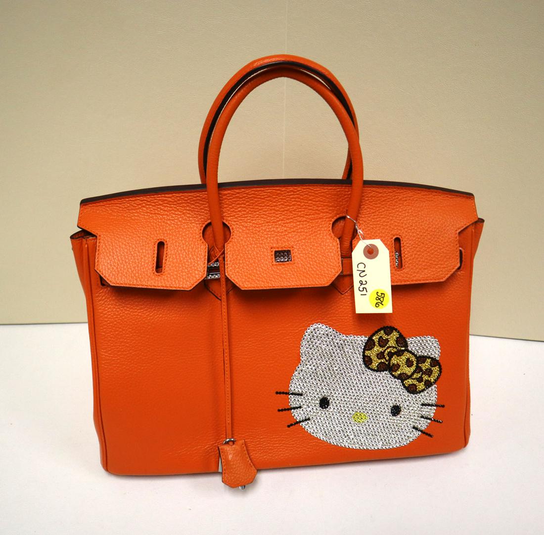 Marked Hermes leather hand bag with hello kitty: Marked Hermes leather hand bag with hello kitty not authenticated approx. 15" w x 8" d x 11"h