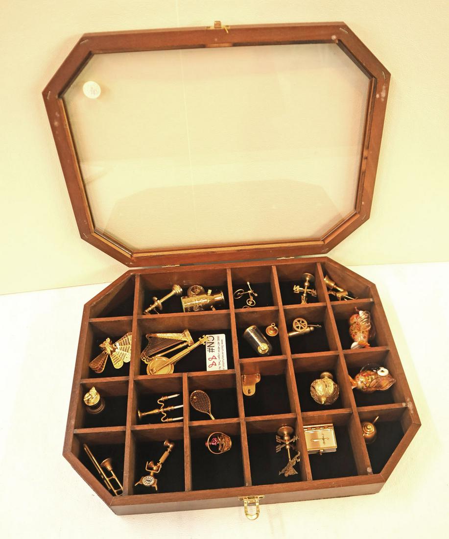 Display box with gold tone miniatures and more: Display box with gold tone miniatures and 2 hand blown art decorator birds