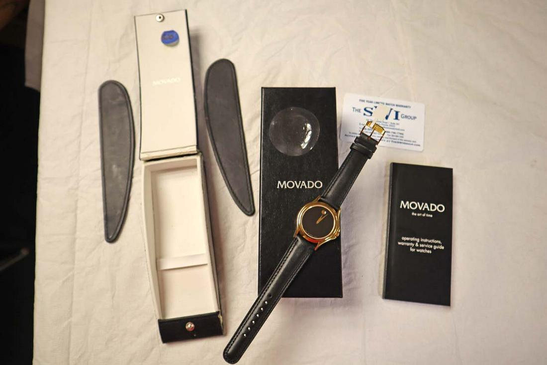 Authentic traditional Movado watch in case: Authentic traditional Movado watch in case plastic still on face, case is damaged. 87-E4-0863/0690301 8786661