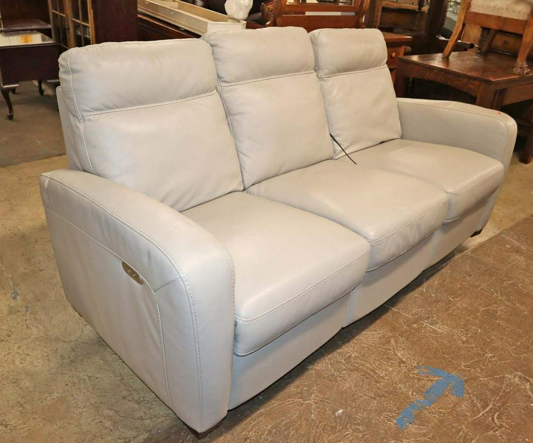 Natuzzi double stitched leather power sofa: Natuzzi double stitch leather power reclining sofa with cord in the off white approx. 77" w x 36" d x 40" h