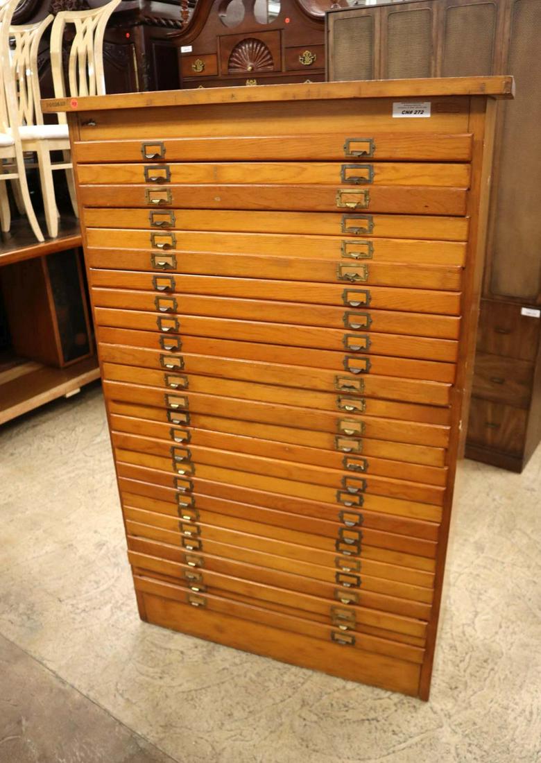 Antique mixed woods printer cabinet: Antique mixed woods printer cabinet with 26 drawers approx. 38" w x 17" d x 59" h