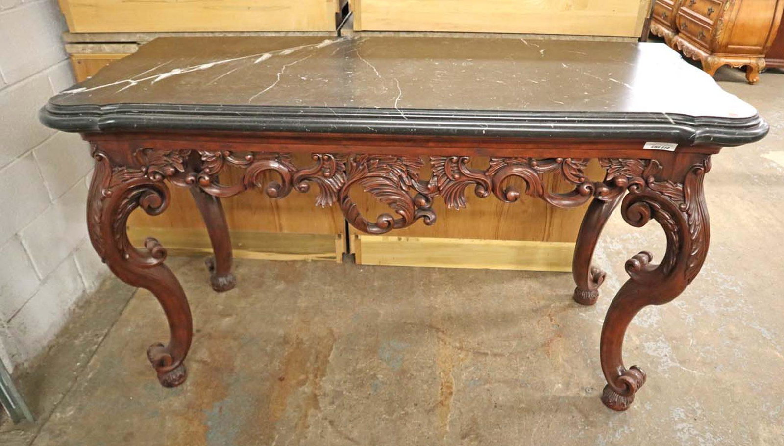 Highly carved mahogany marble top console table: Highly carved mahogany marble top console table in the manner of Ralph Lauren approx. 64" w x 28" d x 37" h
