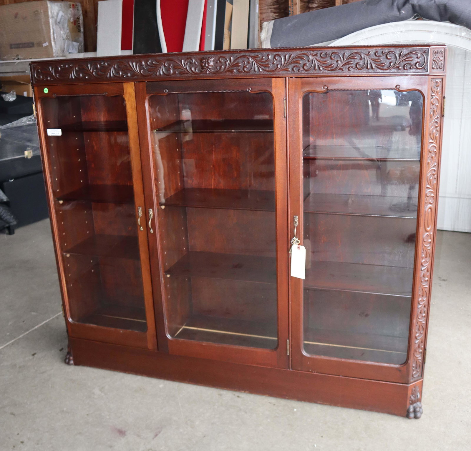 Antique carved mahogany paw foot bookcase (1 of 4)