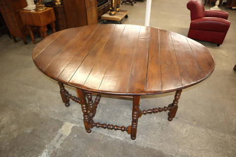 Highland House solid mahogany gate leg table: Highland House quality solid mahogany farm style gate leg drop side table, has an antique style wear mark on top, in the pegged construction approx. Closed: 62" w x 25" d x 30" h opens to Oval: 80" w