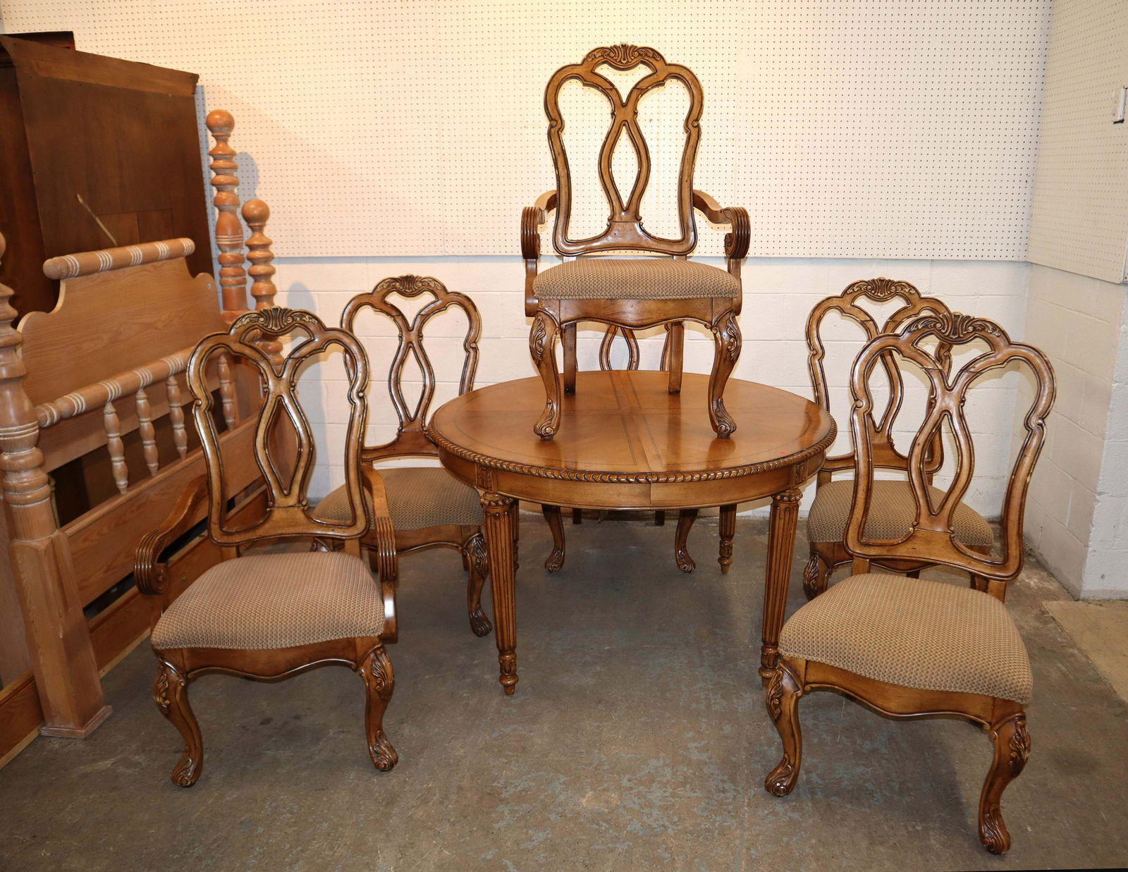 7pc oak andburl walnut dining room set: 7pc oak and burl walnut contemporary dining room table and 6 country French style chairs approx. Table: 50" diameter x 31" h Arm Chairs: 25" w x 24" d x 45" h Side Chairs: 22" w x 24" d x 45" h 20" le
