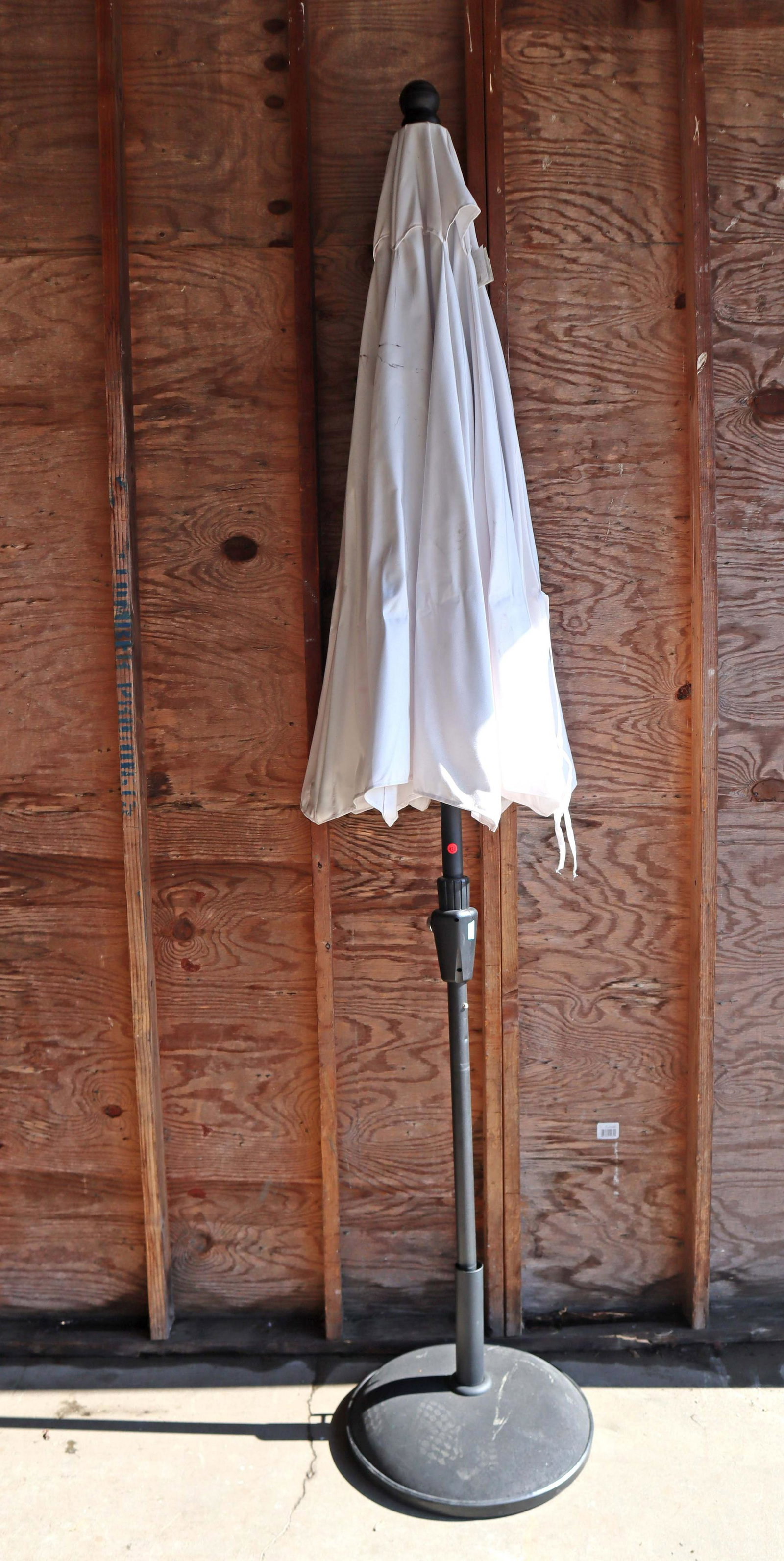 Sunbrella 9' diameter umbrella w/base: Sunbrella 9' diameter umbrella with base, does have some small holes