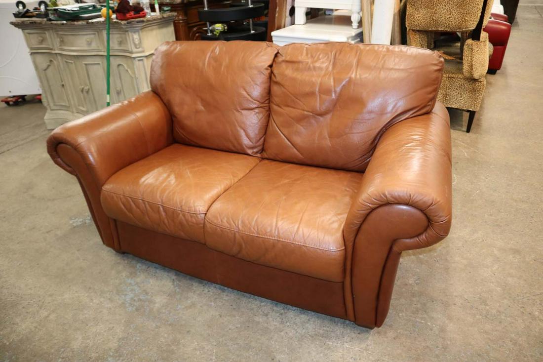 Rust brown leather 2 cushion loveseat: Rust brown leather 2 cushion loveseat approx. 64" w x 36" d x 36" h seat height 19" h