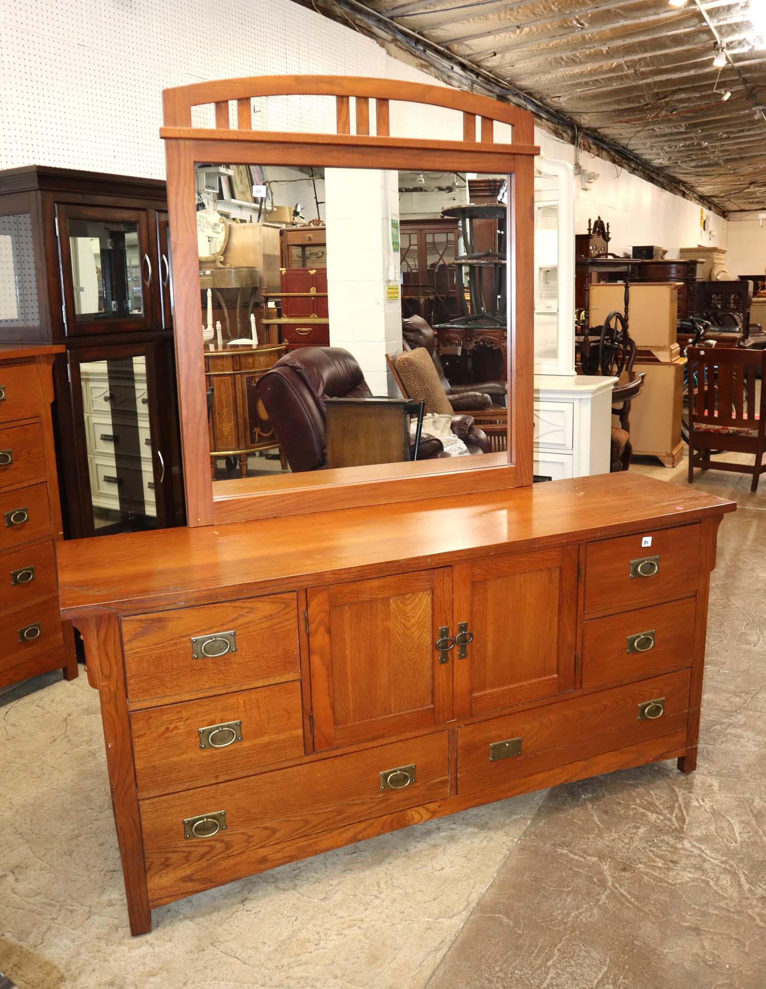 Mission Style Contemporary Broyhill oak 6 drawer 2 door fitted interior dresser with mirror: Mission Style Contemporary Broyhill oak 6 drawer 2 door fitted interior dresser with mirror, top does have wear approx. Dresser: 68" w x 19" d x 32" h Mirror: 41" w x 47" h