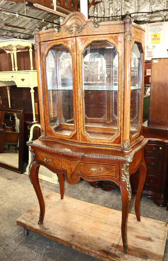 2pc French style walnut/rosewood curio cabinet: 2pc French style walnut and rosewood 1 drawer 2 door curio cabinet with applied bronze approx. 36" w x 20" d x 72" h