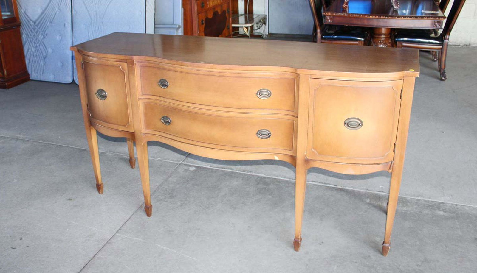 Vintage mahogany spade foot serpentine buffet in as found condition approx. 70" w x23" d x 37" h (1 of 3)