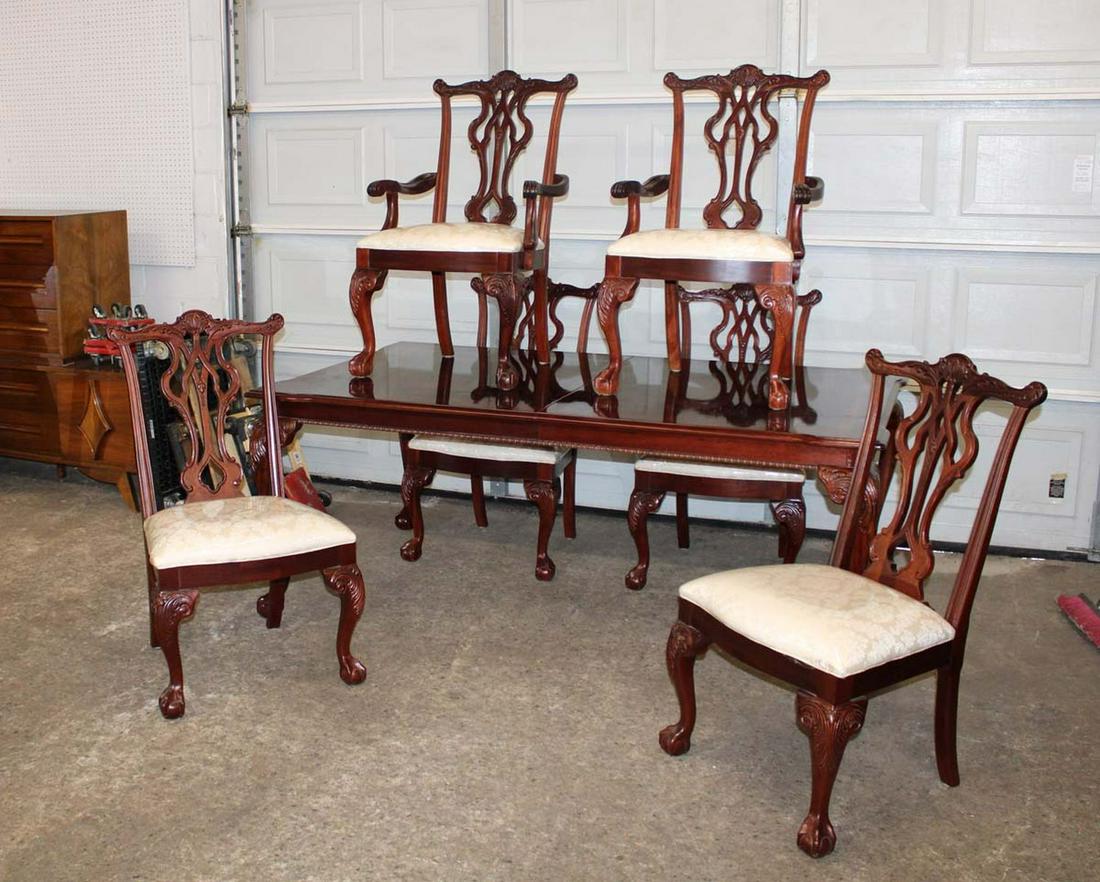 7pc banded burl mahogany dining room table with 6 solid mahogany Chippendale style chairs (2 lvs): 7pc banded burl mahogany dining room table with 6 solid mahogany Chippendale style chairs and 2 leaves approx. Table: 76" w x 45" d x 30" h each leaf 15" Arm Chairs: 24" w x 20" d x 40" h Side Chairs: