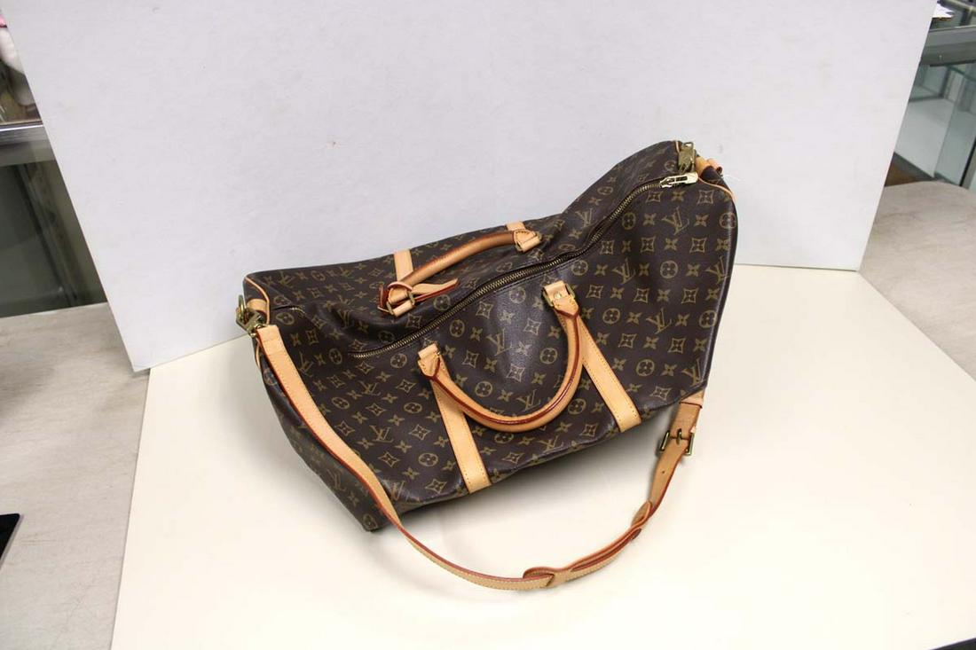Unisex Monogrammed Louis Vuitton style weekender keep all with lock & key: Unisex Monogrammed Louis Vuitton style weekender keep all with lock & key NOT AUTHENTICATED (Bid at your own judgement) approx. 23" w x 10" d x 11" h