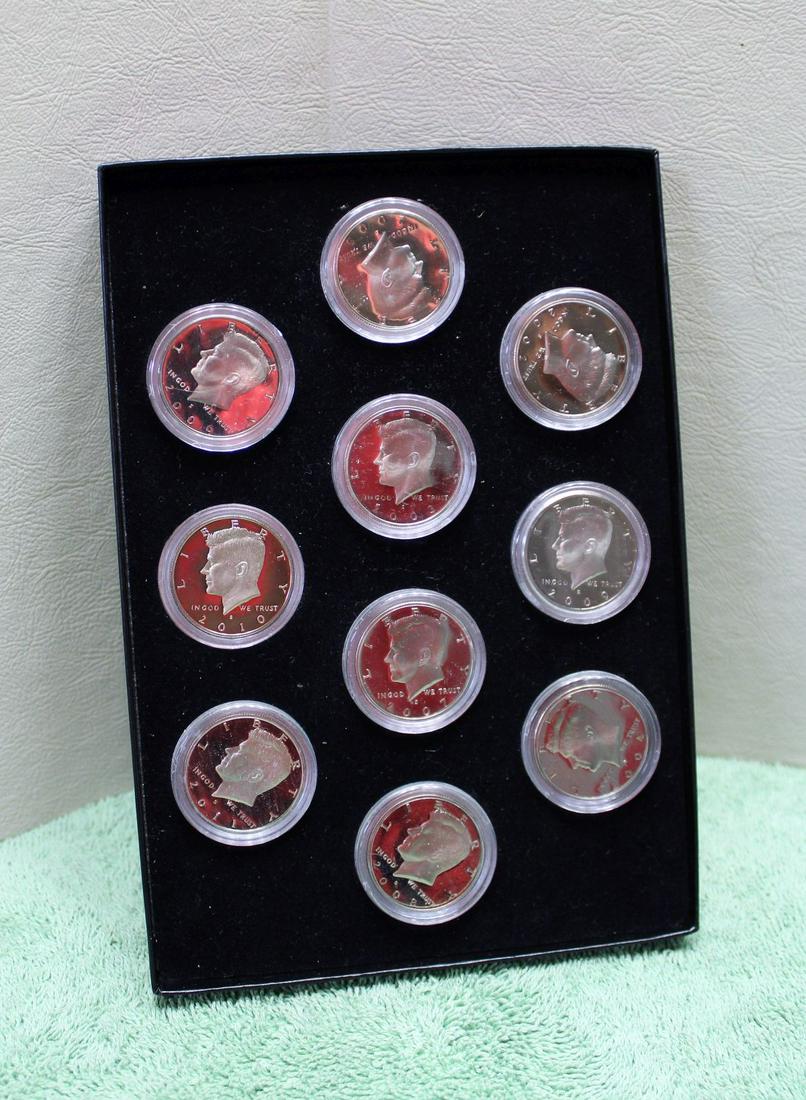 Group lot of 10 Kennedy halves proofs, various dates in presentation box (1 of 2)