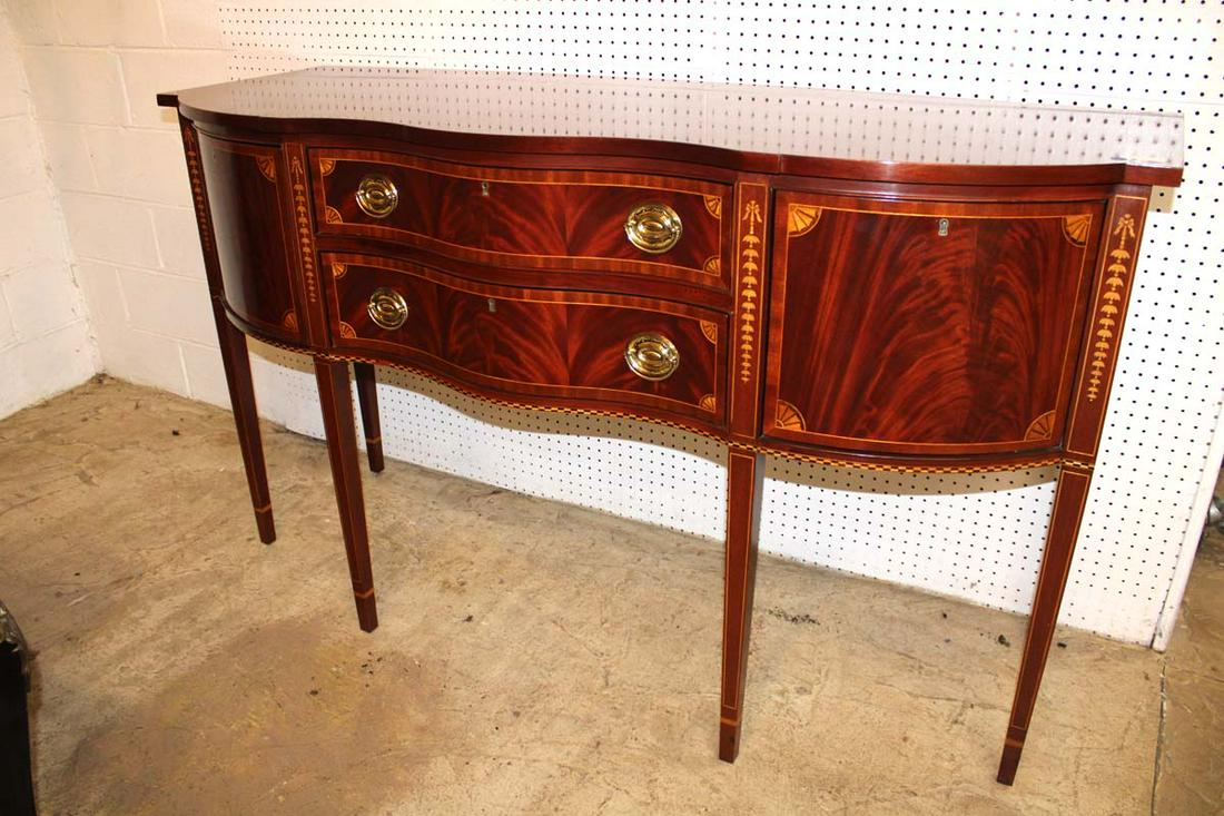 Councill burl mahogany tapered leg sideboard: Beautiful Councill burl mahogany serpentine front tapered leg sideboard with bell flower inlay approx. 66" w x 24" d x 38" h