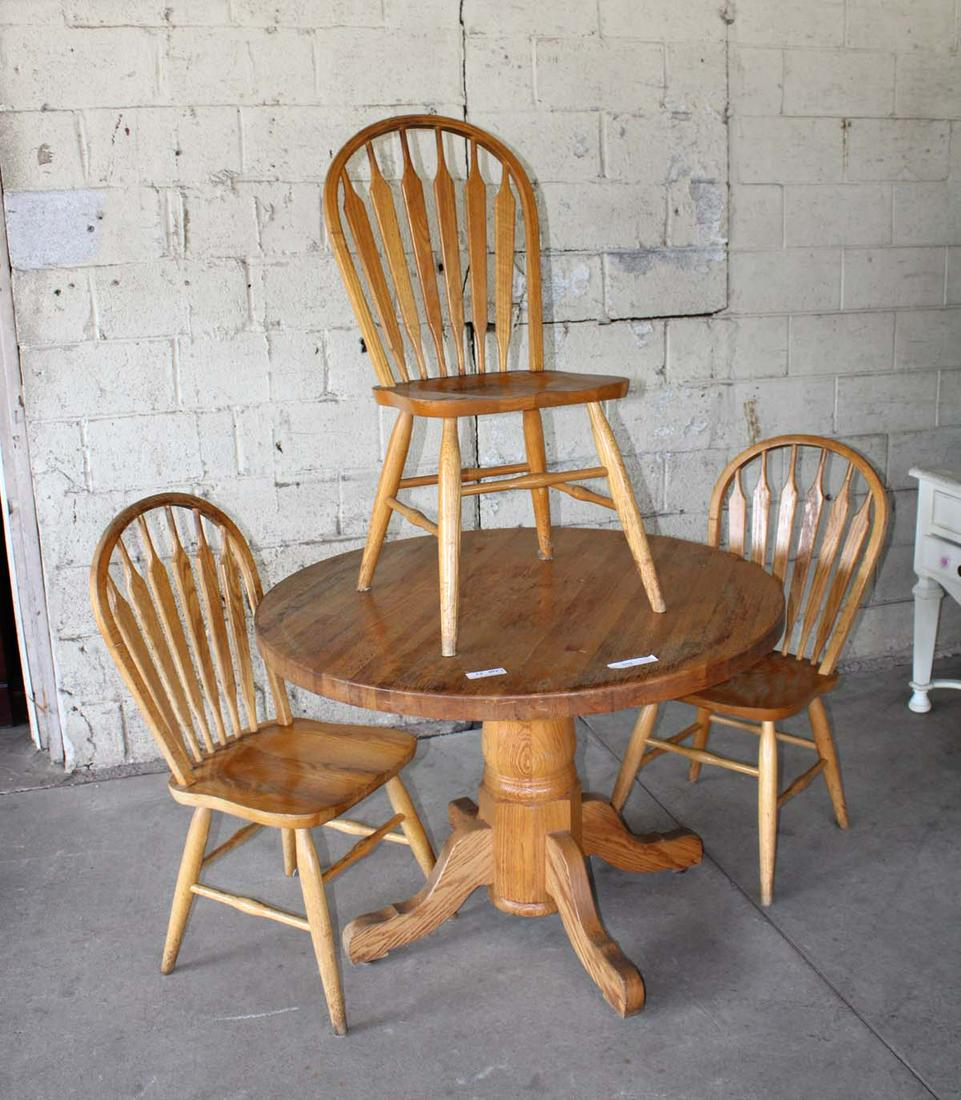 4pc oak breakfast table and 3 chairs: 4pc oak breakfast table and 3 chairs approx. Table: 42" diameter x 30" h Chairs: 19" w x 19" d x 38" h seat height 18"