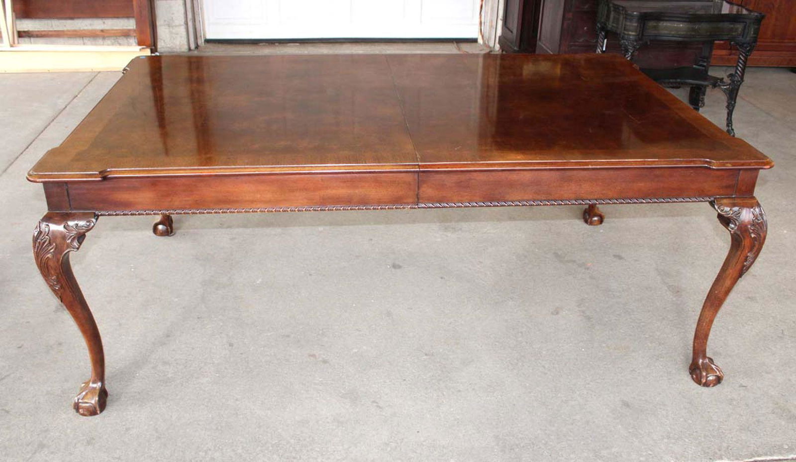 Banded burl mahogany ball and claw dining room table (0570) on Jan 22