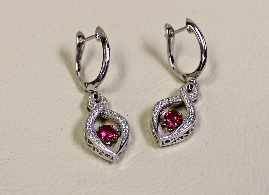 Pair of sterling earrings with ruby style stones (1 of 4)