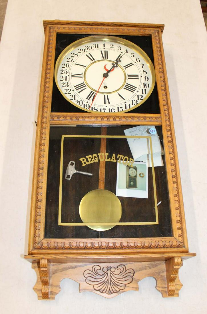 Antique Gilbert 31 day Regulator wall clock in oak case: Antique Gilbert 31 day Regulator wall clock in oak case with key approx. 16" w x 4" d x 36" h