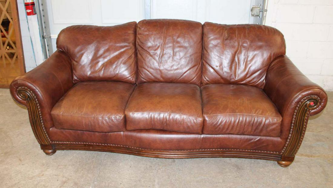 Nice leather 3 cushion sofa with carved mahogany arms and tacking (1 of 5)