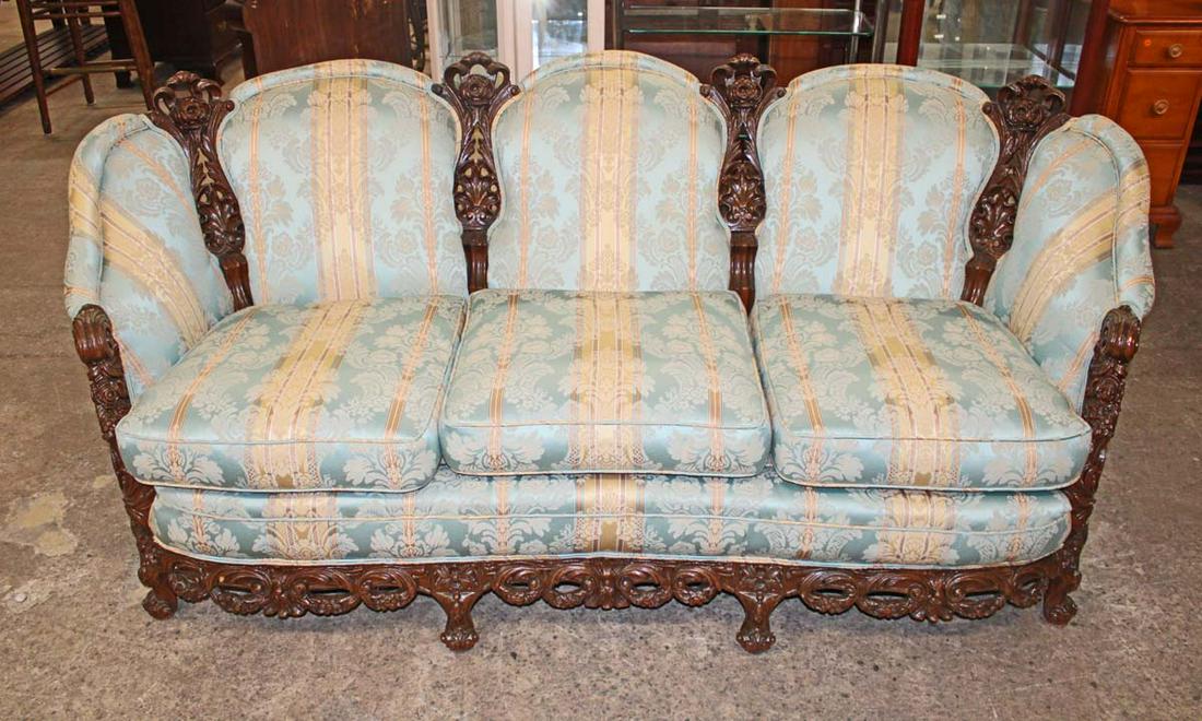 Antique highly carved and ornate walnut frame 3 cushion parlor sofa (1 of 3)