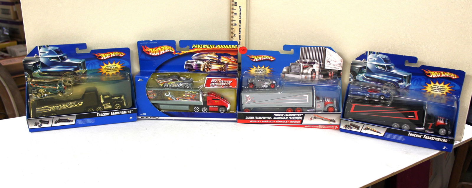 Hot Wheels, 3 truck transporters, pavement pounder, 4pc lot, original packaging not open: Hot Wheels, 3 truck transporters, pavement pounder, 4pc lot, original packaging not open