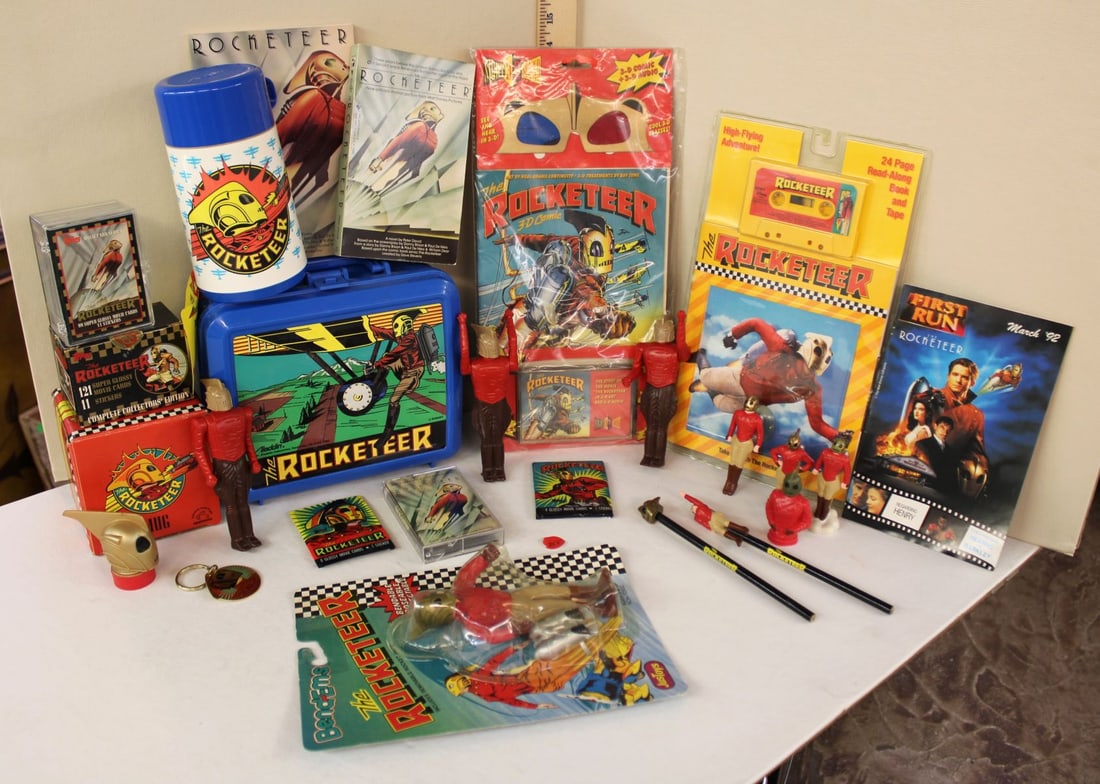 Large lot of Rocketeer collectibles, lunch box with thermos, books, cards, action figures and other: Large lot of Rocketeer collectibles, lunch box with thermos, books, cards, action figures and other